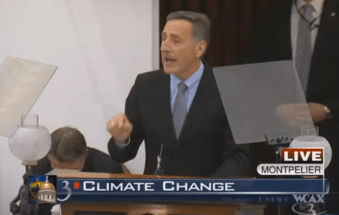 Phil Scott Trying Not To Be Seen during Shumlin's climate remarks. Screengrab from WCAX-TV.